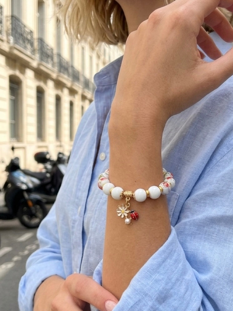 Mia Bracelet – Red Flower Pattern White Porcelain And Chalcedony Beaded Bracelet with Ladybug Charm Handcrafted by Artist Kristine Keina