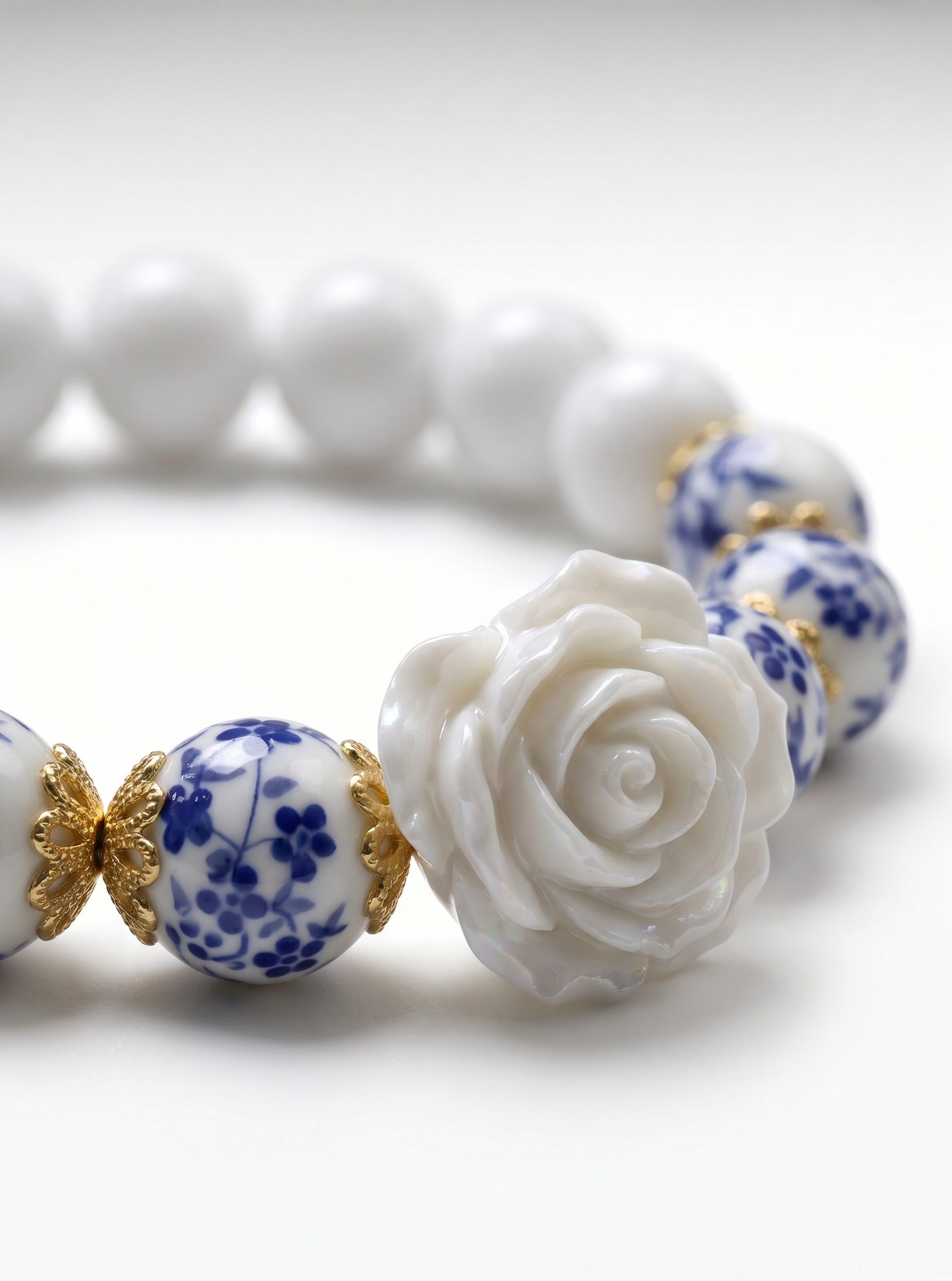 Rosie- Bracelet-Delicate Beauty For Everyday. White Chalcedony & Porcelain Bead Stretchy Bracelet. With Central White Rose Detail and 18k Gold Plated Bead Cups.
Handcrafted by Artist Kristine Keina