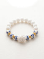 Rosie- Bracelet-Delicate Beauty For Everyday. White Chalcedony & Porcelain Bead Stretchy Bracelet. With Central White Rose Detail and 18k Gold Plated Bead Cups.
Handcrafted by Artist Kristine Keina